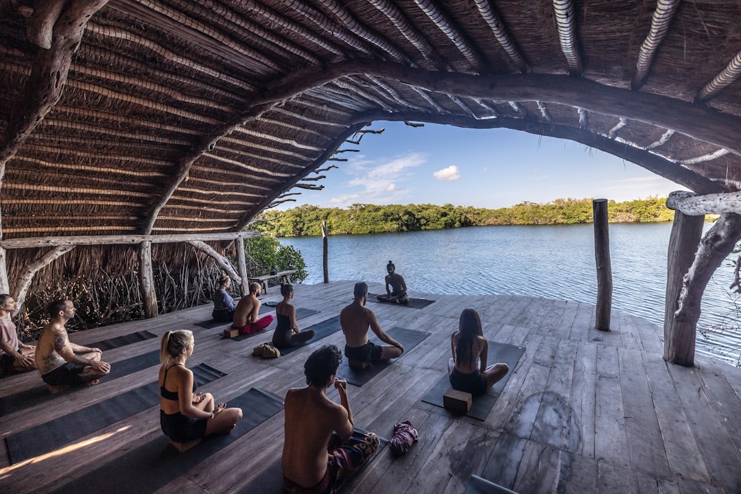 Mastering the First Impression: Your intriguing post title goes here a-group-of-people-sitting-on-top-of-a-wooden-floor-uqcwuxfalww